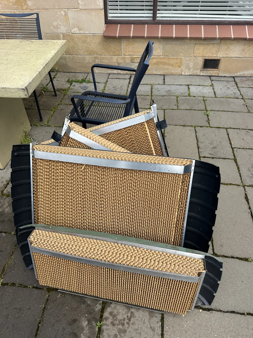 New evaporative cooling pads fitted into their frames